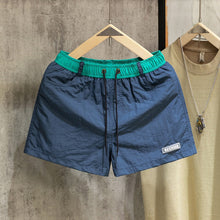 Load image into Gallery viewer, Loose-fit Color-block Beach Shorts with Lining