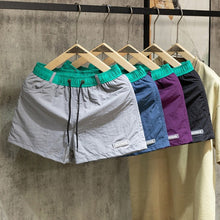 Load image into Gallery viewer, Loose-fit Color-block Beach Shorts with Lining