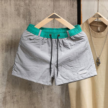 Load image into Gallery viewer, Loose-fit Color-block Beach Shorts with Lining
